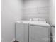 The laundry room features a new washer and dryer with a wire shelf above at 217 Basildon St # 1018, Lancaster, SC 29720