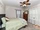 Comfortable bedroom with carpeted floors, ample natural light, and a ceiling fan at 22 Walnut Nw Ave # 1, Concord, NC 28027