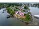 Aerial view of waterfront home construction on peninsula near lake at 22554 John Gamble Rd, Cornelius, NC 28031