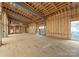 Interior framing of a new home with large windows offering a glimpse of the exterior at 22554 John Gamble Rd, Cornelius, NC 28031