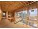 Interior construction showing framing, large windows, and an exterior view of the lake at 22554 John Gamble Rd, Cornelius, NC 28031