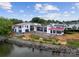 Exterior view of a modern home under construction near the water at 22554 John Gamble Rd, Cornelius, NC 28031