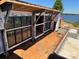 Exterior of new construction showcasing large window design and waterfront views at 22554 John Gamble Rd, Cornelius, NC 28031