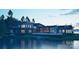 Rendering of modern waterfront home with large windows overlooking the lake at dusk at 22554 John Gamble Rd, Cornelius, NC 28031