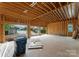 Unfinished garage with exposed framing and view of neighborhood at 22554 John Gamble Rd, Cornelius, NC 28031