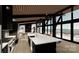 Open-concept kitchen with a large island, modern appliances, and views of the lake and pool area at 22554 John Gamble Rd, Cornelius, NC 28031