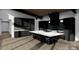 Stylish kitchen with a large island, bar seating, modern cabinetry, and stainless steel appliances at 22554 John Gamble Rd, Cornelius, NC 28031