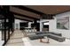 Spacious living room with modern furnishings, an open floor plan, and a view to the kitchen at 22554 John Gamble Rd, Cornelius, NC 28031
