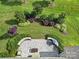 Aerial view of a paved outdoor patio with a built-in grill and landscaped backyard at 2364 Delaney Dr, Fort Mill, SC 29715