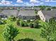 Manicured backyard featuring mature landscaping, a stone patio, and a well-maintained lawn at 2364 Delaney Dr, Fort Mill, SC 29715