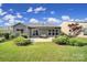 A lush backyard with a patio, built in grill, seating area, and well-maintained lawn at 2364 Delaney Dr, Fort Mill, SC 29715