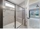 A tiled shower with a glass enclosure and a built-in seat adds luxury to this bathroom at 2364 Delaney Dr, Fort Mill, SC 29715