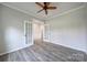 Bright bedroom with french doors, neutral paint, crown molding, and hardwood floors, creating a peaceful atmosphere at 2364 Delaney Dr, Fort Mill, SC 29715