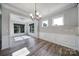 Bright dining room with chair rail molding and large windows overlooking the backyard at 2364 Delaney Dr, Fort Mill, SC 29715