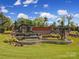 Community entrance featuring water features, stone walls, and mature landscaping at 2364 Delaney Dr, Fort Mill, SC 29715