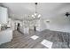 Spacious kitchen with island, stainless appliances and wine cooler, seamlessly connects to the living area at 2364 Delaney Dr, Fort Mill, SC 29715