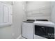 Laundry room includes a wire rack for storage and newer model washer and dryer at 2364 Delaney Dr, Fort Mill, SC 29715