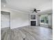 Open living room featuring a fireplace, ceiling fan and natural light at 2364 Delaney Dr, Fort Mill, SC 29715