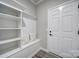 Mudroom features a bench with storage shelves, decorative pillows and hooks at 2364 Delaney Dr, Fort Mill, SC 29715