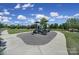 Community playground with climbing structures and slides, set against a bright blue sky and lush greenery at 2364 Delaney Dr, Fort Mill, SC 29715
