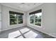 Bright sunroom with large windows offering views of the lush backyard at 2364 Delaney Dr, Fort Mill, SC 29715