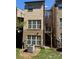The backyard featuring a small balcony, perfect for enjoying outdoor space from upper level at 243 Lincoln St, Charlotte, NC 28203