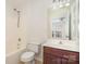 Bathroom features a shower/tub combo, toilet, and vanity at 243 Lincoln St, Charlotte, NC 28203