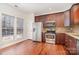 Bright kitchen with stainless steel appliances and hardwood flooring at 243 Lincoln St, Charlotte, NC 28203