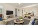 Spacious living room features a foosball table, modern decor, and ample natural light for entertaining and relaxation at 243 Lincoln St, Charlotte, NC 28203