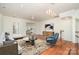 Inviting living room featuring hardwood floors, modern lighting, and comfortable seating at 243 Lincoln St, Charlotte, NC 28203