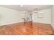 Spacious living room with hardwood floors and staircase access to upper level at 243 Lincoln St, Charlotte, NC 28203