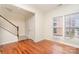 Bright room with staircase, window, and hardwood floors at 243 Lincoln St, Charlotte, NC 28203