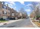 Exterior view showcasing the street and charming townhomes, plus street parking at 243 Lincoln St, Charlotte, NC 28203