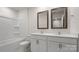 Bright bathroom featuring double vanity, neutral tiling, and a tub with shower at 2605 Goose Fair Rd, Maiden, NC 28650
