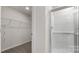 Modern bathroom featuring a glass-enclosed shower and convenient closet space at 2605 Goose Fair Rd, Maiden, NC 28650