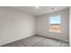 A cozy bedroom space with plush carpet and a bright window view at 2605 Goose Fair Rd, Maiden, NC 28650
