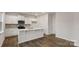 Modern kitchen with stainless steel appliances, quartz countertops, and center island at 2605 Goose Fair Rd, Maiden, NC 28650