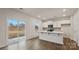 Bright, open-concept kitchen featuring an island and sliding glass doors to the outdoors at 2605 Goose Fair Rd, Maiden, NC 28650