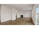Spacious living room area with hardwood floors, fireplace, and lots of natural light at 2605 Goose Fair Rd, Maiden, NC 28650