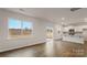 Open living area with hardwood floors, a sliding glass door, and bright white walls at 2605 Goose Fair Rd, Maiden, NC 28650