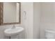 Well-lit powder room featuring a stylish mirror and pedestal sink at 2605 Goose Fair Rd, Maiden, NC 28650