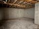 Open basement featuring a concrete floor and walls, along with exposed ceiling beams at 2924 Noritake Trl # 67, Albemarle, NC 28001