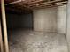 Unfinished basement with concrete walls, exposed wood beams, and visible ceiling pipes at 2924 Noritake Trl # 67, Albemarle, NC 28001