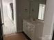 Bathroom with vanity featuring a sink, cabinets and large mirror at 2924 Noritake Trl # 67, Albemarle, NC 28001