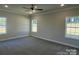 Spacious bedroom with carpeting, neutral walls, ceiling fan, and plenty of natural light from the many windows at 2924 Noritake Trl # 67, Albemarle, NC 28001
