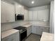 Beautiful modern kitchen features white cabinets, granite countertops, stainless appliances, and tile backsplash at 2924 Noritake Trl # 67, Albemarle, NC 28001