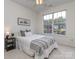 Bright bedroom with large window, comfortable bed and natural light at 3066 Orion Dr, Fort Mill, SC 29707