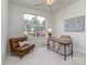 Cozy bedroom features a comfortable chair, desk, and plenty of natural light at 3066 Orion Dr, Fort Mill, SC 29707