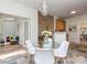 Bright breakfast nook featuring a glass table, modern chairs, and stylish accents at 3066 Orion Dr, Fort Mill, SC 29707
