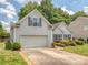 View of the home's exterior, highlighting the attached garage, landscaping, and well-maintained lawn at 3066 Orion Dr, Fort Mill, SC 29707